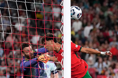 2024–25 UEFA Nations League, Portugal vs Scotland: Portugal's Joao Felix, right, misses to score as Scotland's goalkeeper Angus Gunn makes a save 